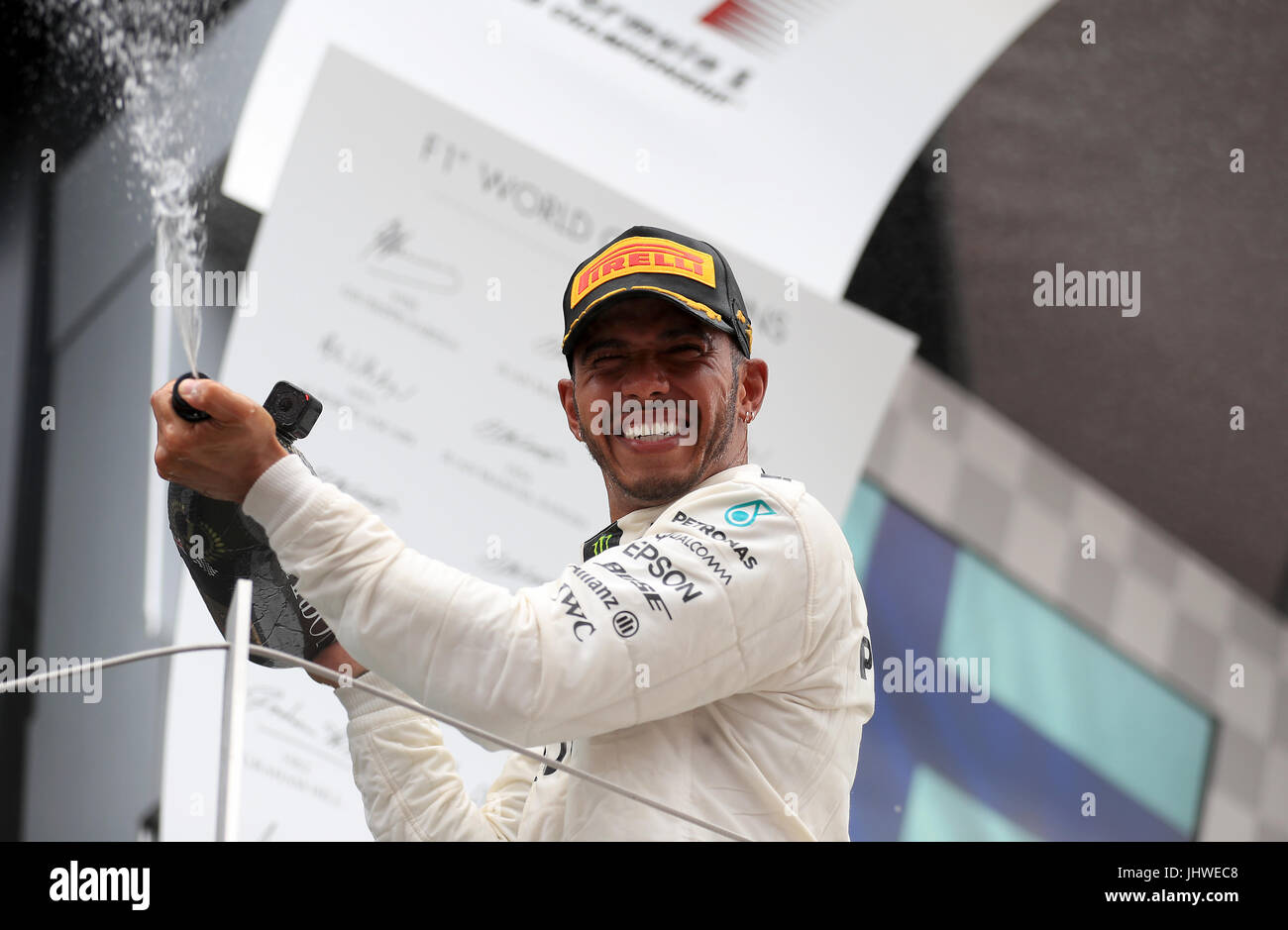 Mercedes' Lewis Hamilton celebrates his victory during the 2017 British Grand Prix at Silverstone Circuit, Towcester. PRESS ASSOCIATION Photo. Picture date: Sunday July 16, 2017. See PA story AUTO British. Photo credit should read: Tim Goode/PA Wire. Stock Photo