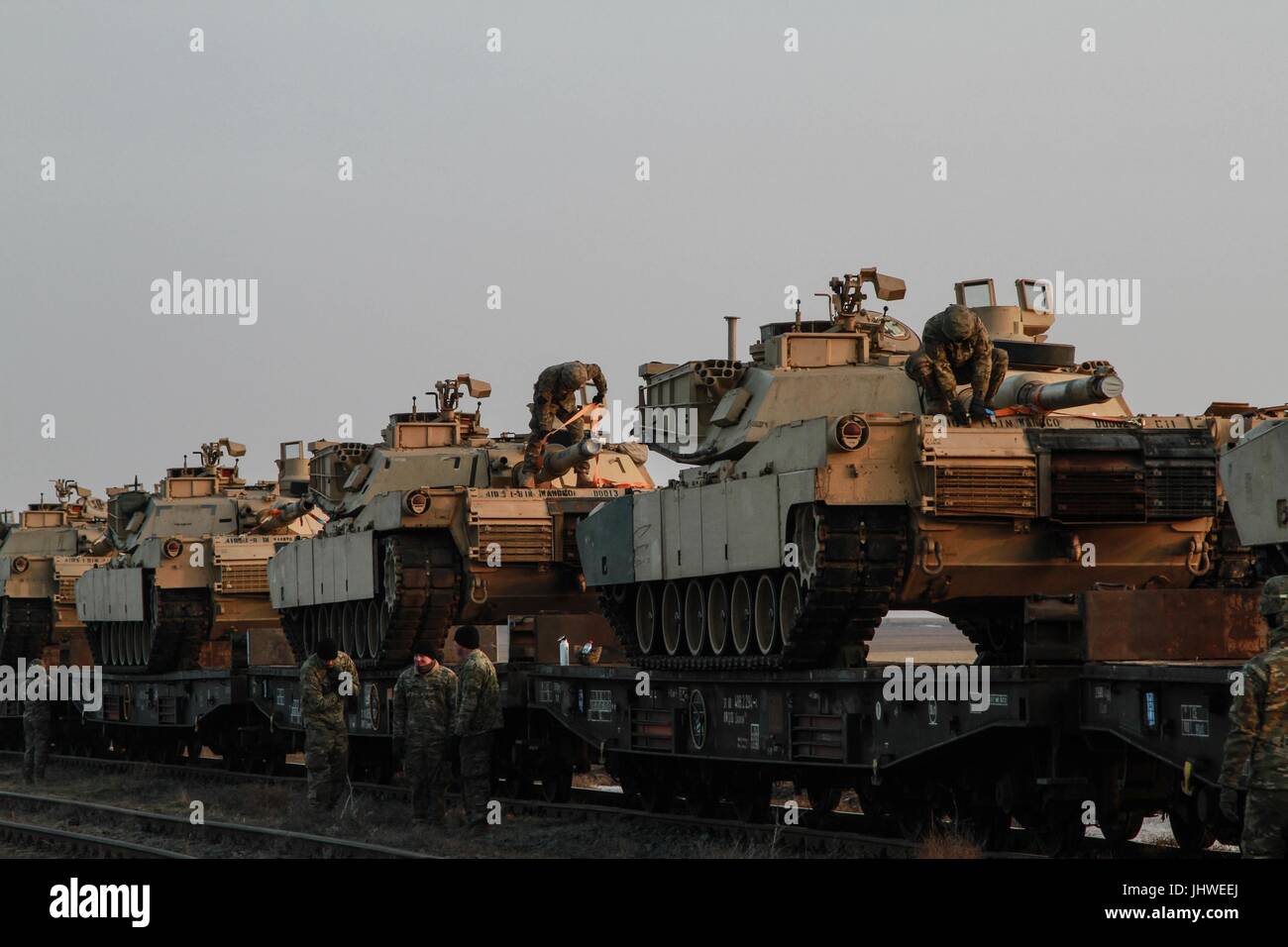 U.S. soldiers prep their battle tanks for offloading from rail cars at the Mihail Kogalniceanu Airbase February 14, 2017 in Mihail Kogalniceanu, Romania.    (photo by Devone Collins via Planetpix) Stock Photo