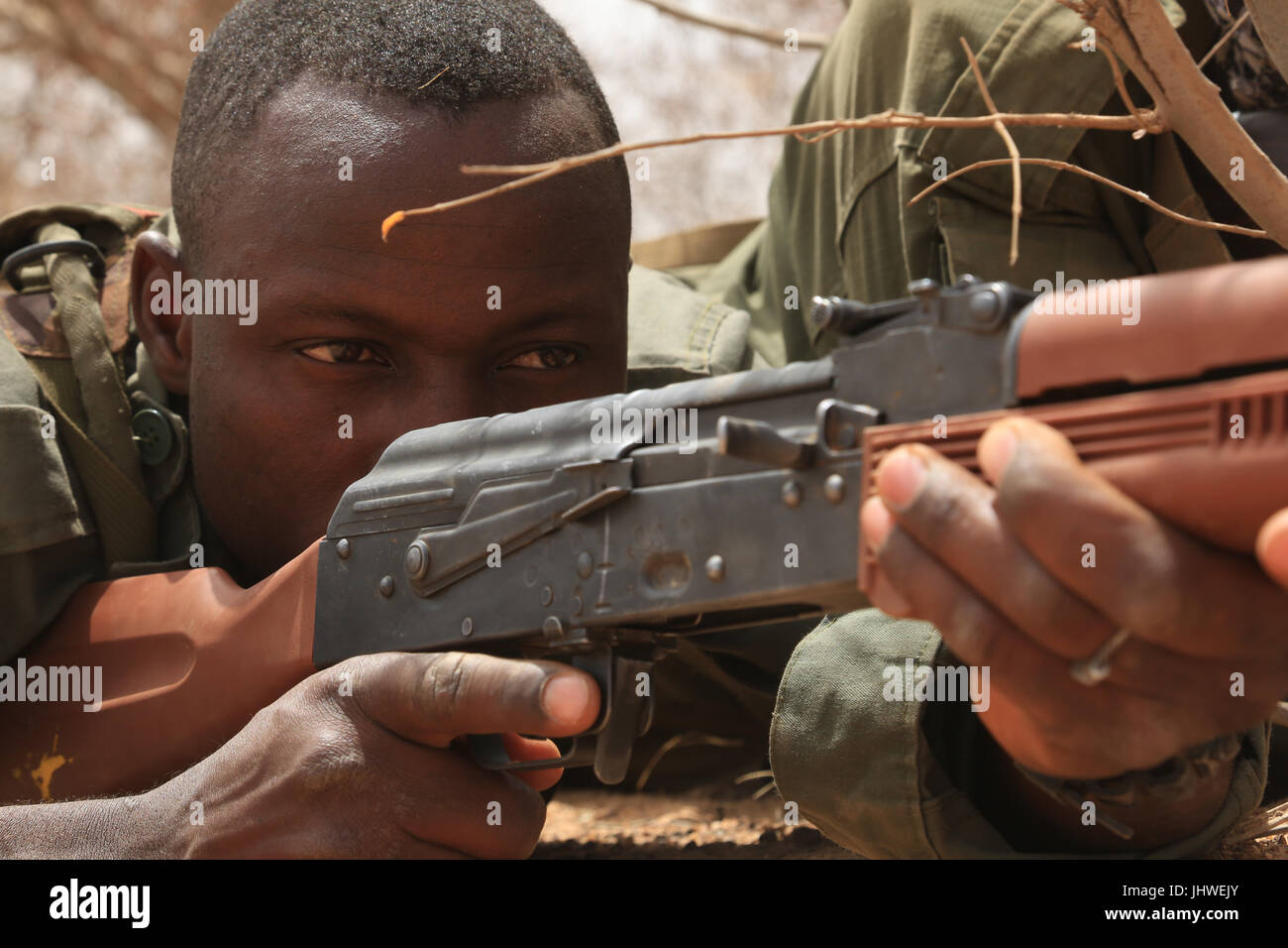 Burkinabe soldiers prepare to ambush a squad during an exercise at Camp Zagre March 2, 2017 in Ouagadougou, Burkina Faso.    (photo by Peter Seidler  via Planetpix) Stock Photo