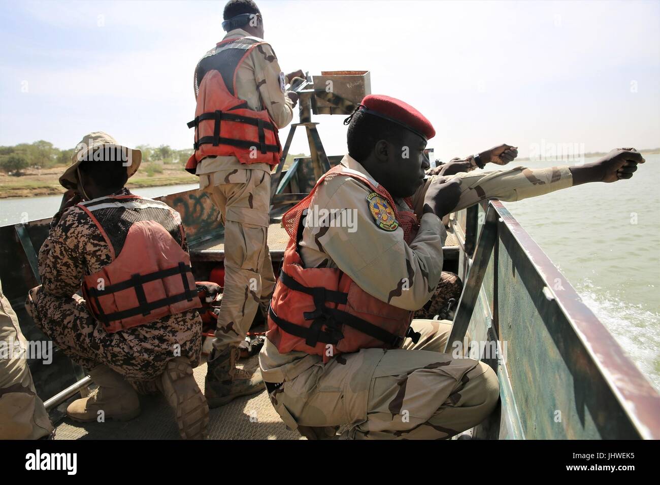 Chadian soldiers simulate holding weapons as they prepare for a beach infiltration during maritime training on the Chari River for exercise Flintlock March 3, 2017 in NÕDjamena, Chad.    (photo by Terrance Payton via Planetpix) Stock Photo