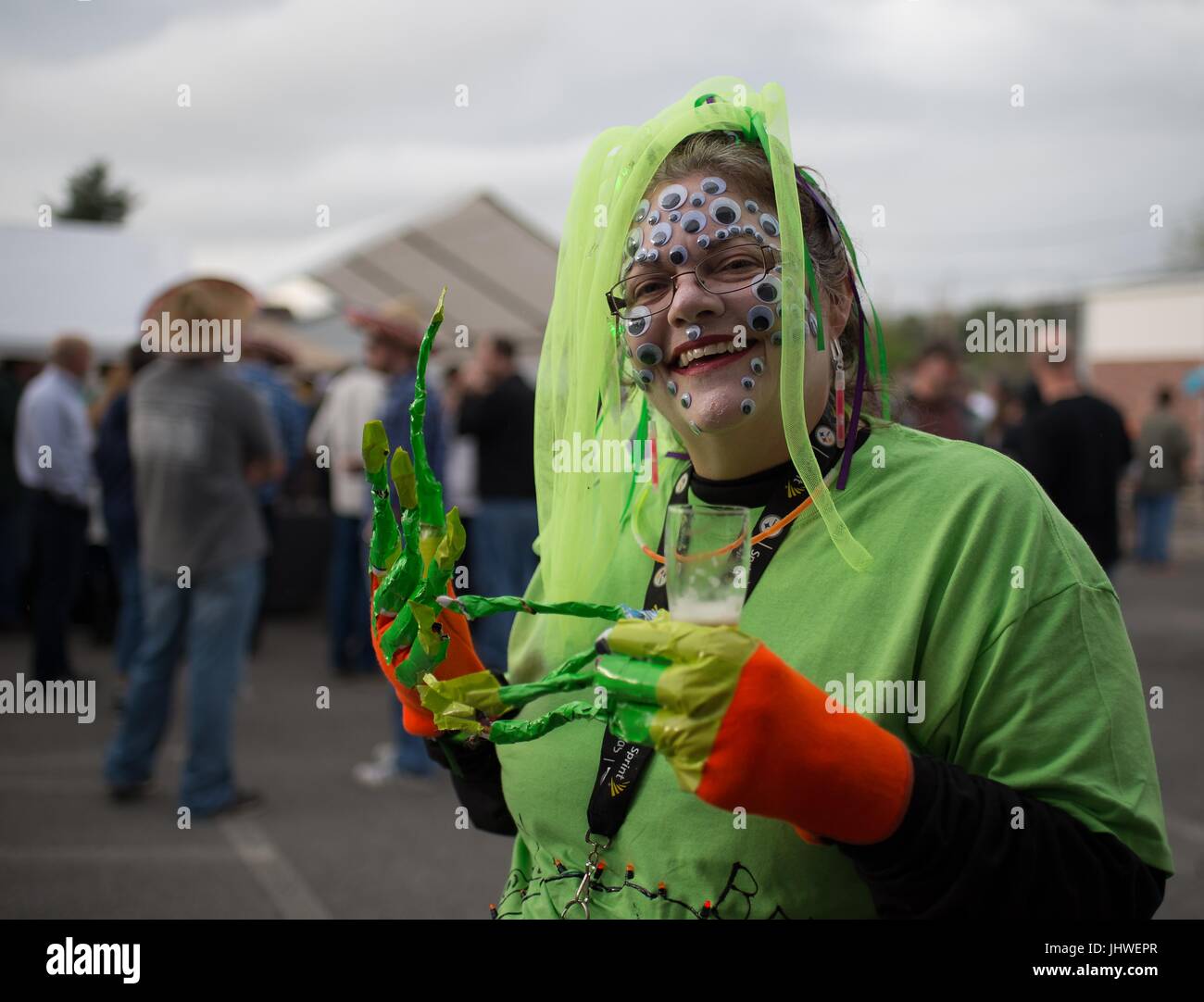 A local resident visits the Mars Brew before participating in an alien costume contest during the NASA Mars New Year celebration May 5, 2017 in Mars, Pennsylvania.     (photo by Bill Ingals via Planetpix) Stock Photo