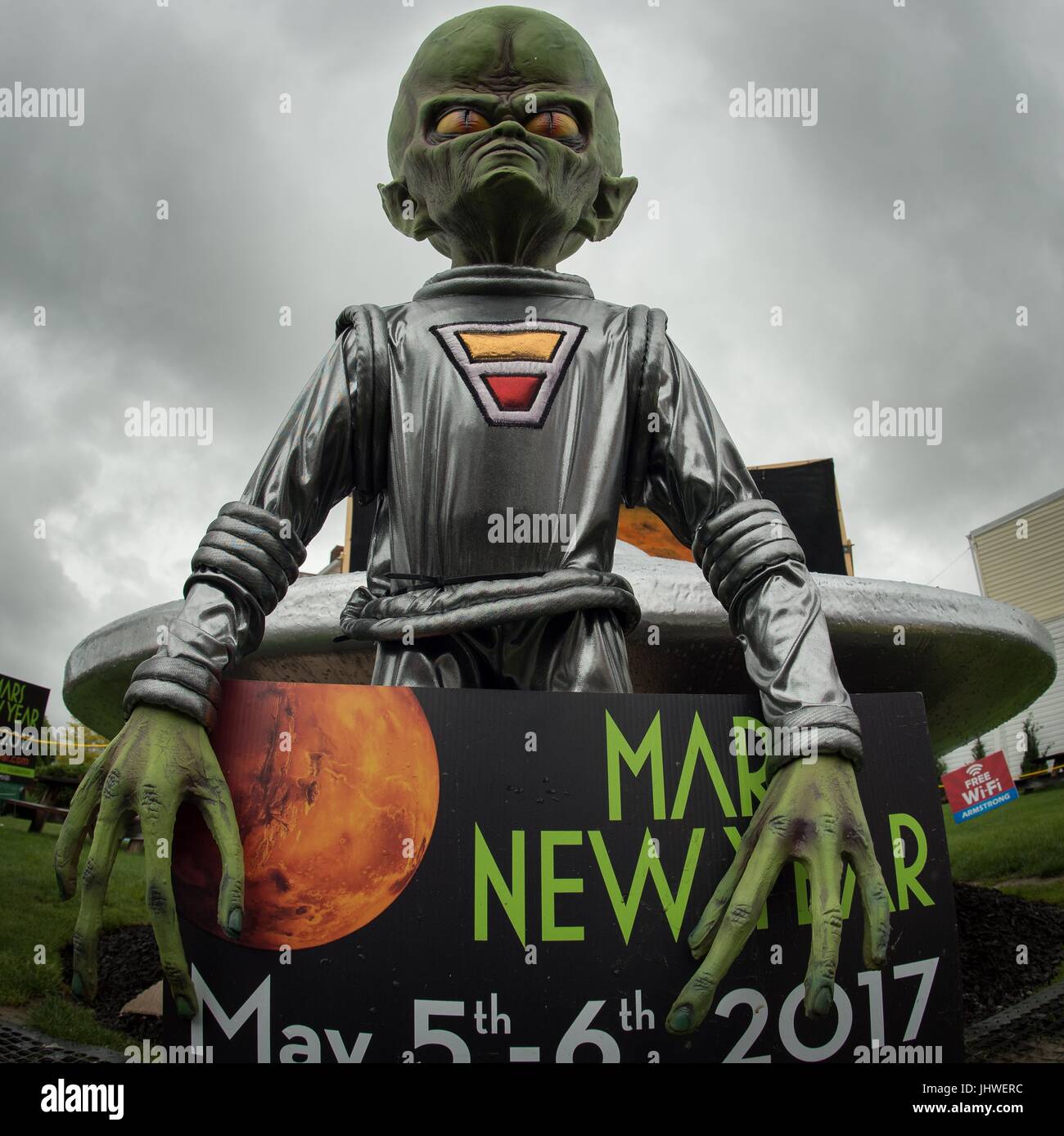 A model alien and spacecraft welcomes visitors to the NASA Mars New Year celebration May 6, 2017 in Mars, Pennsylvania.     (photo by Bill Ingals via Planetpix) Stock Photo