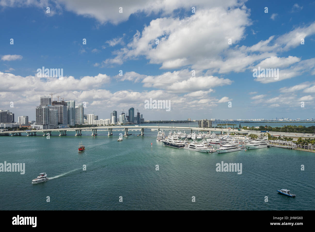 The City of Miami, looking northwest toward docked luxury yachts off Watson Island and the MacArthur Causeway from the ferry terminal on Dodge Island. Stock Photo
