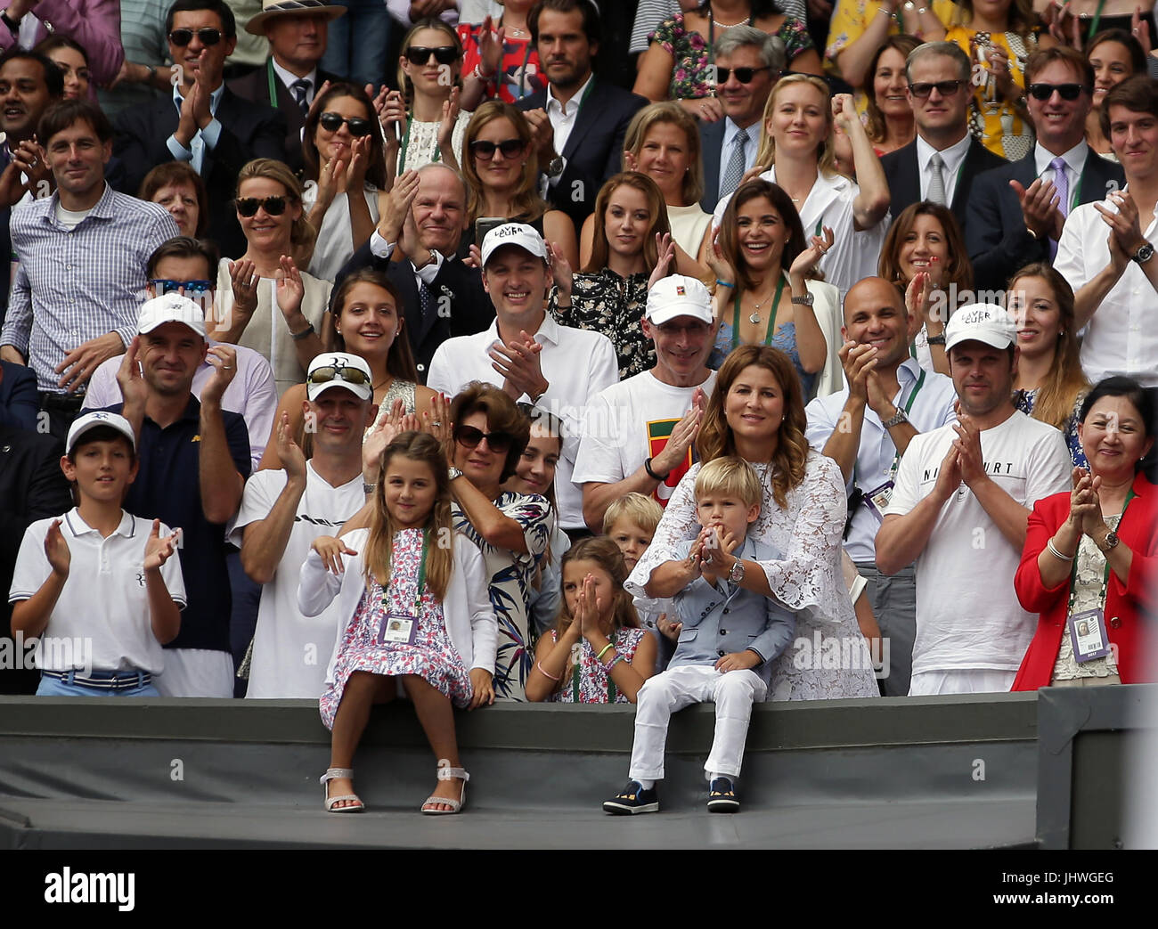 Charlene Riva Federer, Myla Rose Federer, Lenny Federer, Leo Federer, with their mother Mirka Federer and grandmother, Lynette Federer after Roger Federer wins the the Gentlemen's Singles Final on day thirteen of the Wimbledon Championships at The All England Lawn Tennis and Croquet Club, Wimbledon. Stock Photo