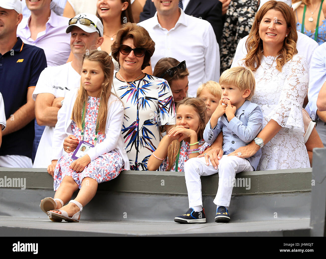 Charlene Riva Federer, Myla Rose Federer, Lenny Federer, Leo Federer, with their mother Mirka Federer and grandmother, Lynette Federer after Roger Federer wins the the Gentlemen's Singles Final on day thirteen of the Wimbledon Championships at The All England Lawn tennis and Croquet Club, Wimbledon. Stock Photo