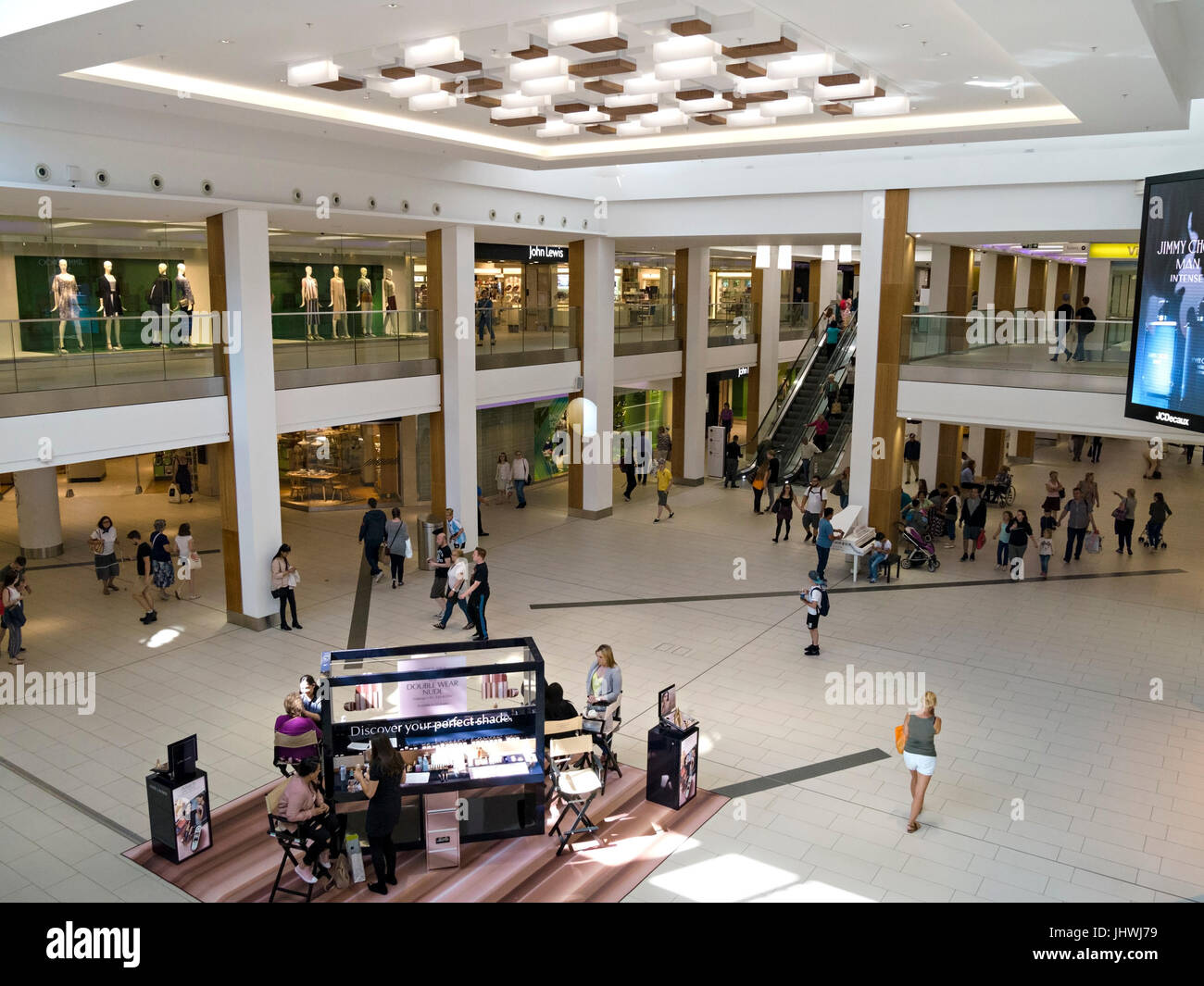 Shops, shoppers and Plaza inside Victoria Centre shopping mall