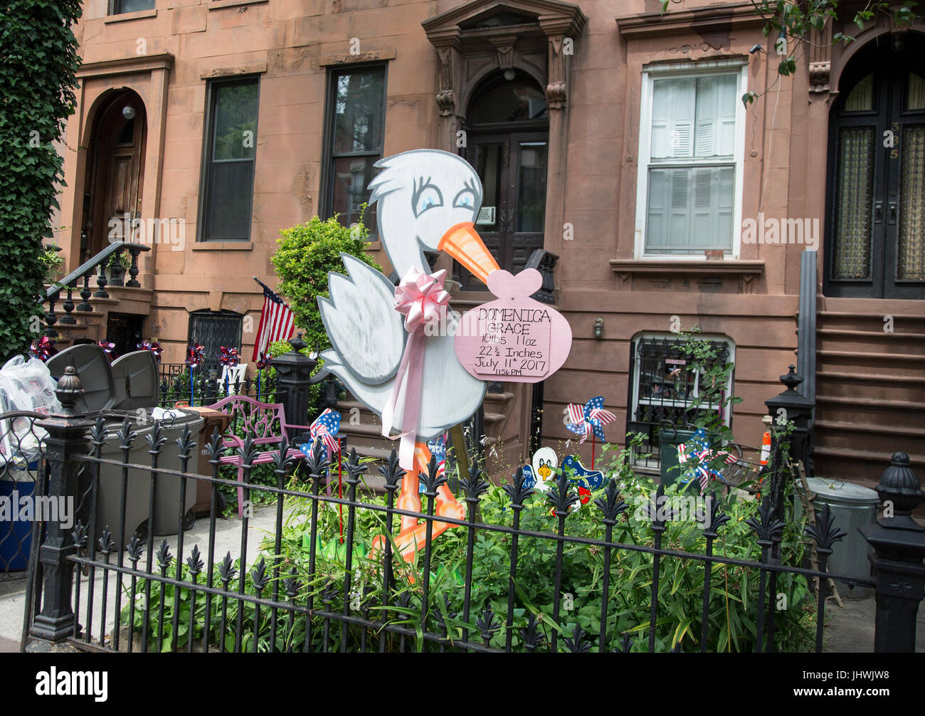 Birth announcement in front of a Brooklyn brownstone Stock Photo
