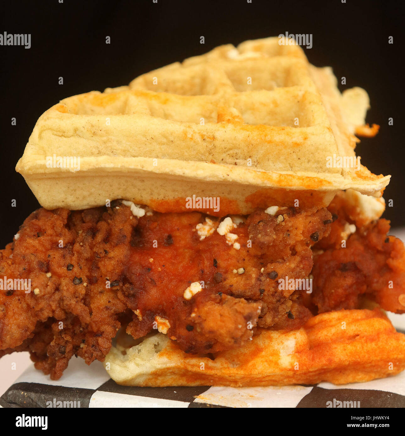 Belgian waffle sandwich with hot battered chicken, feta cheese, hot