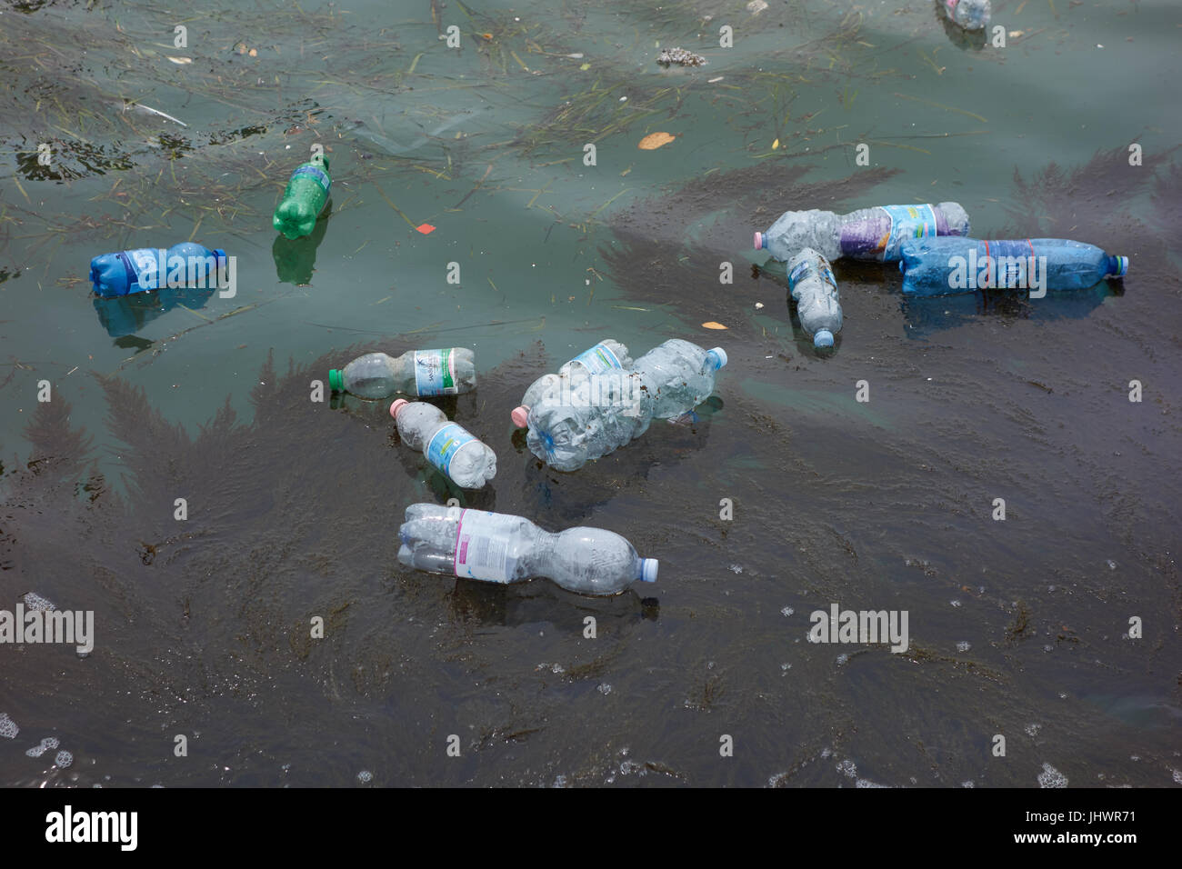 Plastic bottles floating in water. Venic. Italy Stock Photo - Alamy