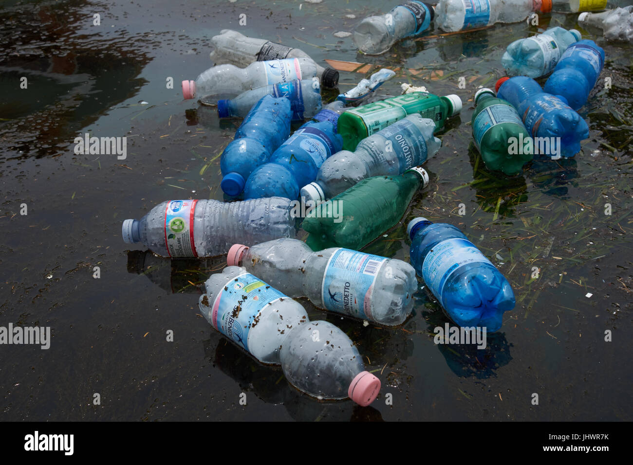 Plastic bottles floating in water. Venic. Italy Stock Photo - Alamy