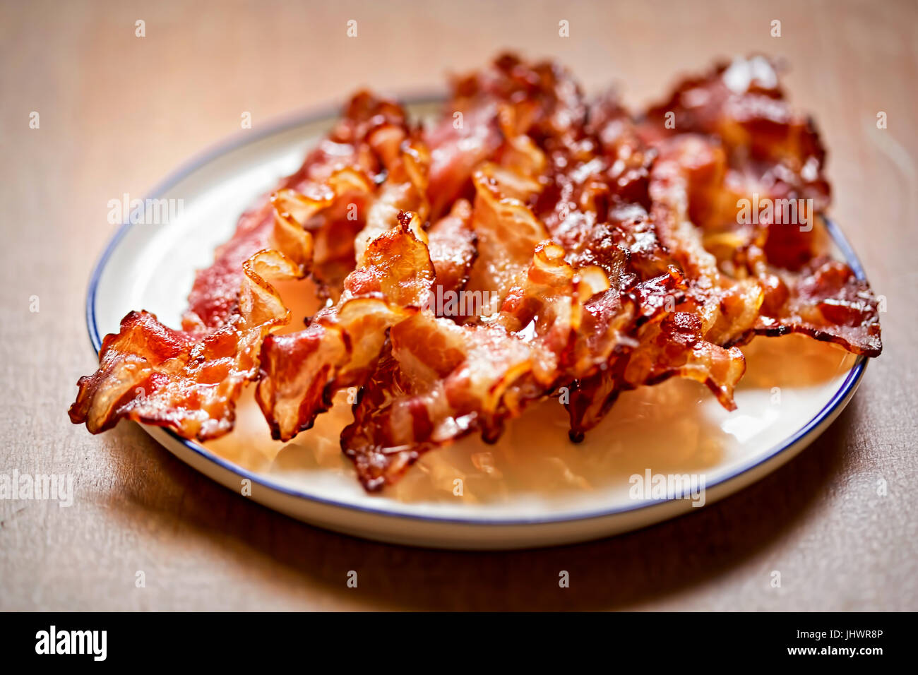 Streaky fried bacon rashers Stock Photo
