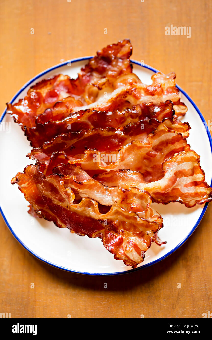 Streaky fried bacon rashers Stock Photo Alamy