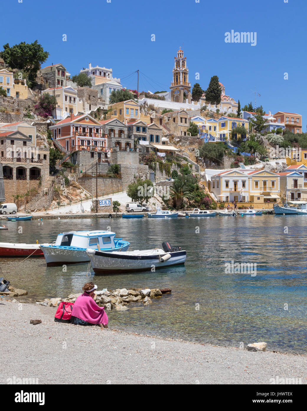 Symi Island, South Aegean, Greece - time to relax by the harbour at the main town / port, Gialos (or Yialos, as it is also known) Stock Photo