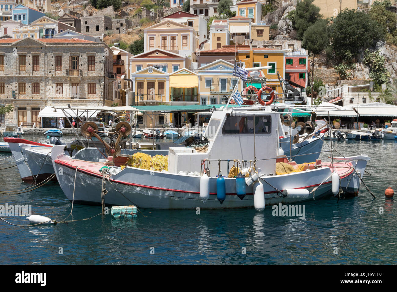 Symi Island, South Aegean, Greece - fishing boats in the harbour at the main town / port, Gialos (or Yialos, as it is also known) Stock Photo
