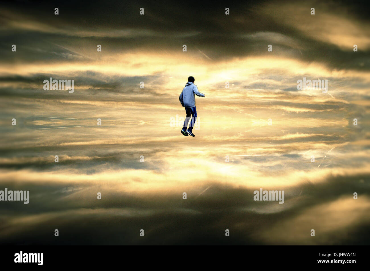 Boy jumping to the Universe Stock Photo