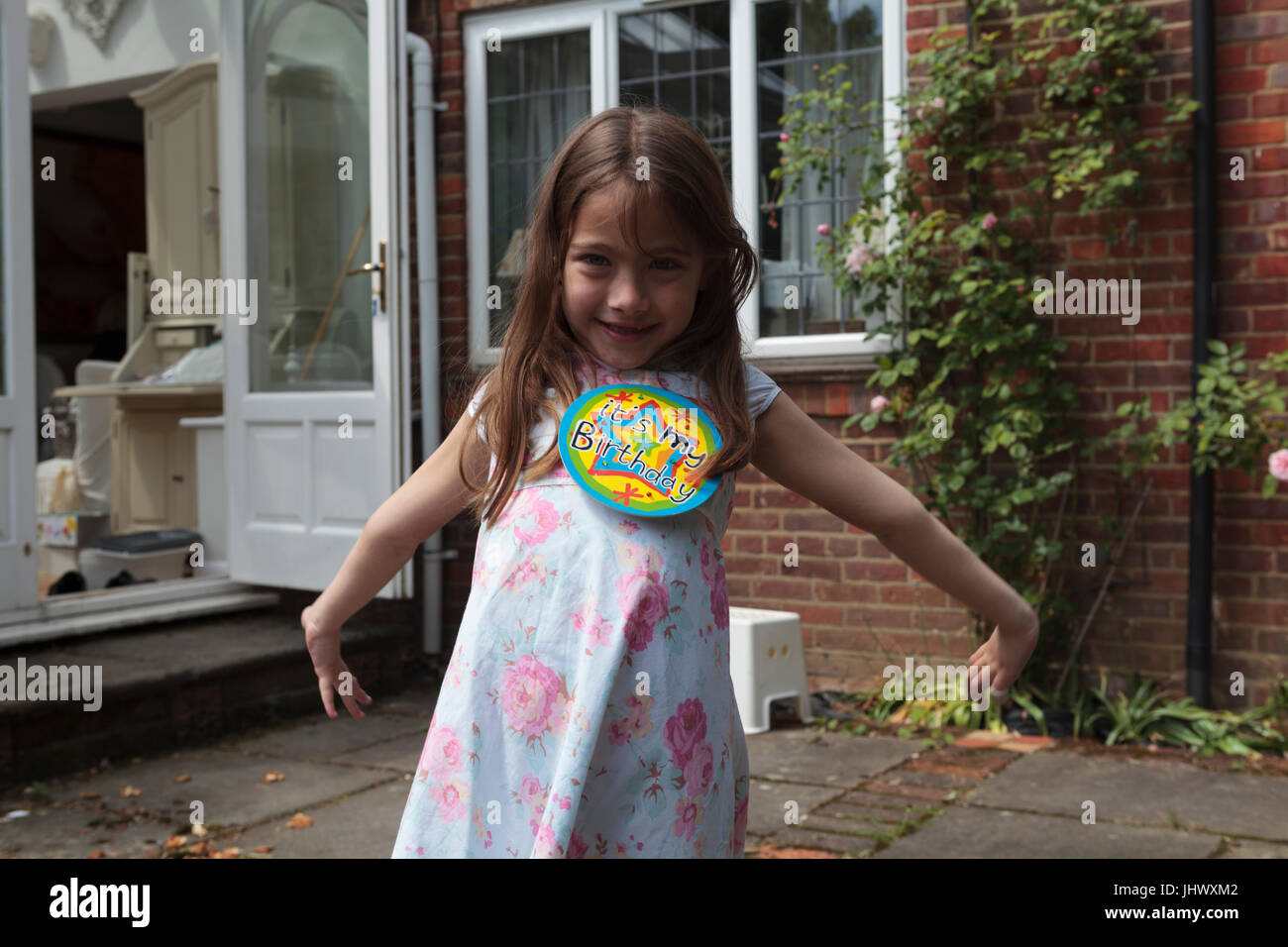 Young Caucasian girl on her birthday aged 7 Stock Photo