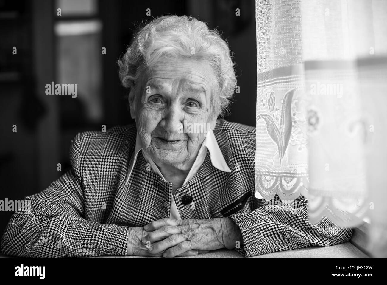 Old wrinkled face woman sitting Black and White Stock Photos & Images ...