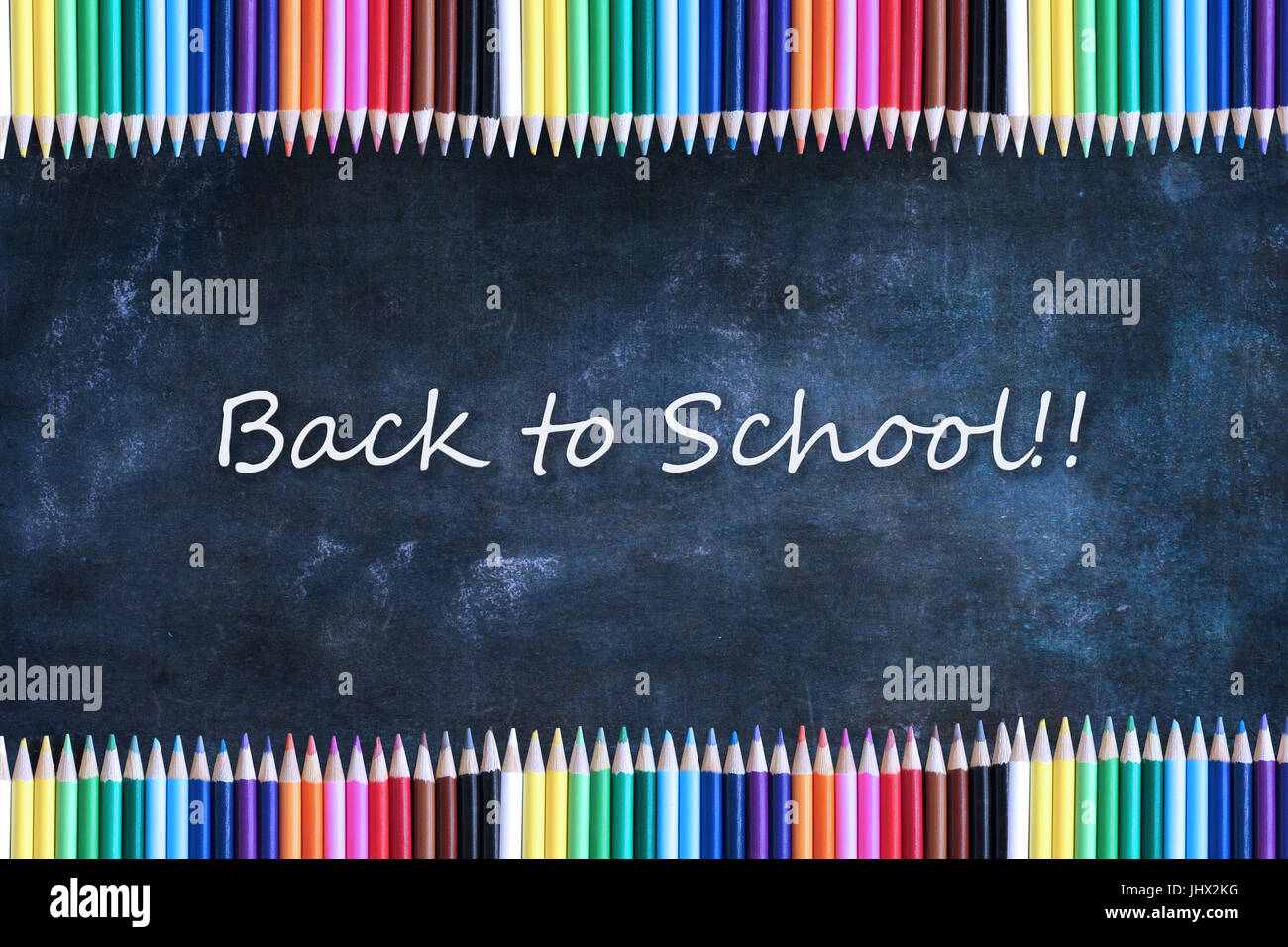 School chalkboard or blackboard and colored pencils with Back to School ...