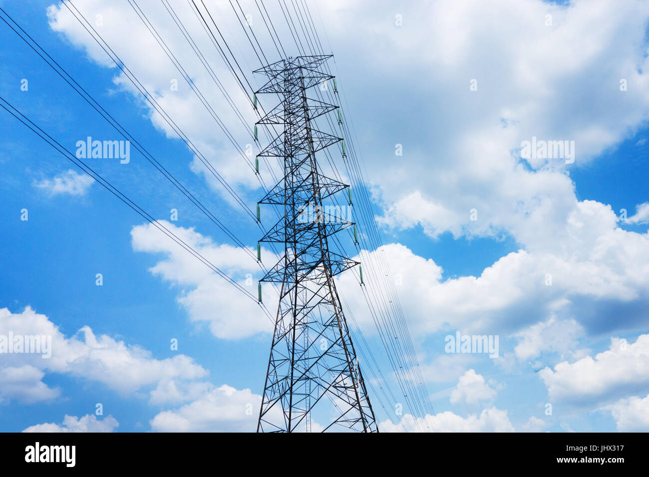 high voltage pole blue sky background Stock Photo - Alamy