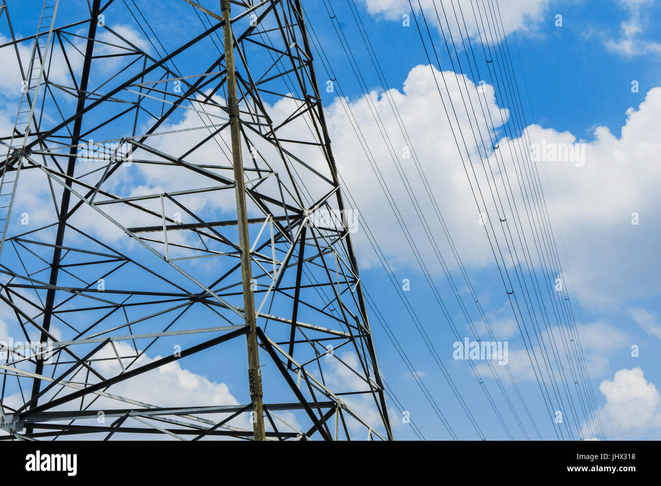 high voltage pole blue sky background Stock Photo - Alamy