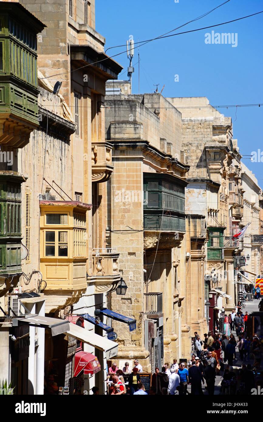 Tourists walking along Republic Street aka Triq Ir Repubblika, Valletta, Malta, Europe. Stock Photo