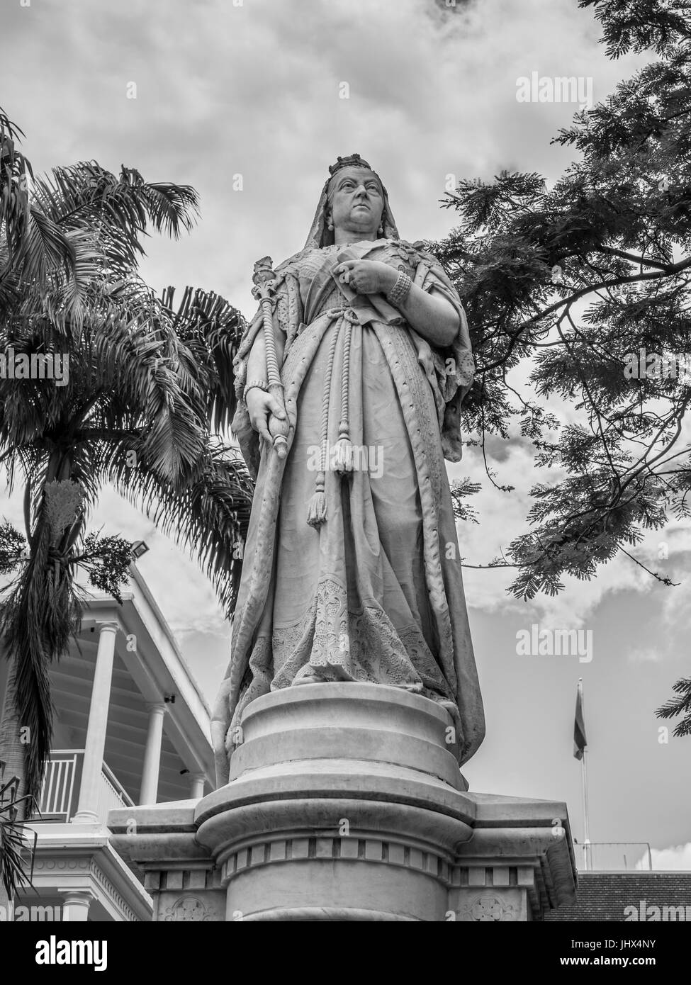Port Louis, Mauritius - December 25, 2015: Statue of Queen Victoria, Government House in Port Louis, Mauritius. Black and white photography. Stock Photo