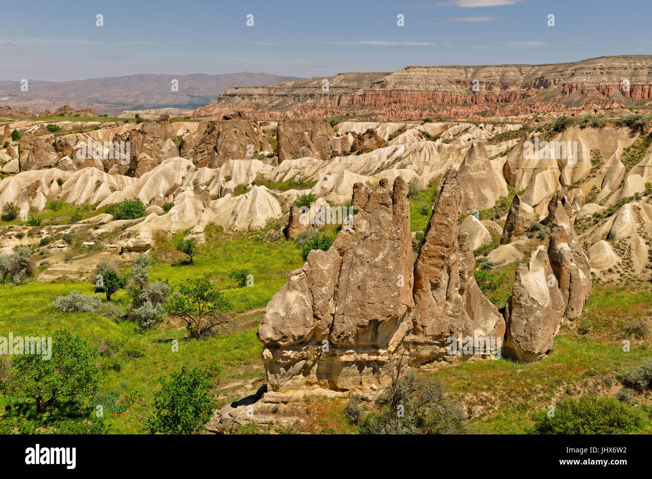 Cappadocia terrain with fairy chimneys and Red valley canyon beyond. Cappadocia Turkey. Stock Photo