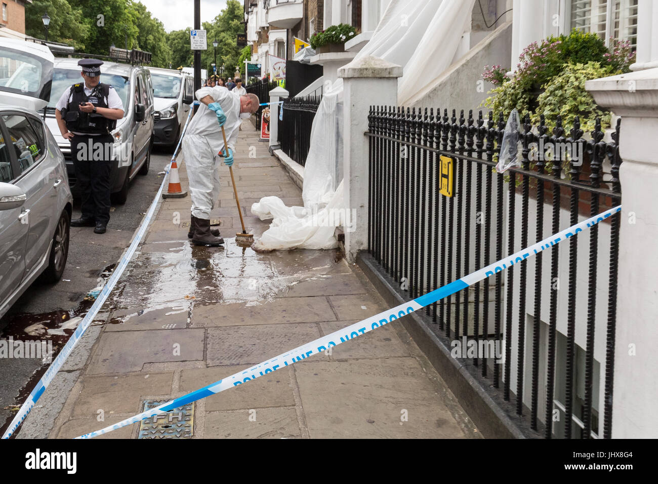 London, UK. 16th July, 2017. Greenwich murder investigation. Police forensic teams clean up after investigations at the scene of the crime. Danny Pearce, 31, was stabbed to death by two men on a moped near Greenwich Park in the early hours of Saturday who ordered him to hand over his mobile phone. The victim was fatally wounded during a clash in which shots were also fired the Metropolitan Police have said.© Guy Corbishley/Alamy Live News Stock Photo