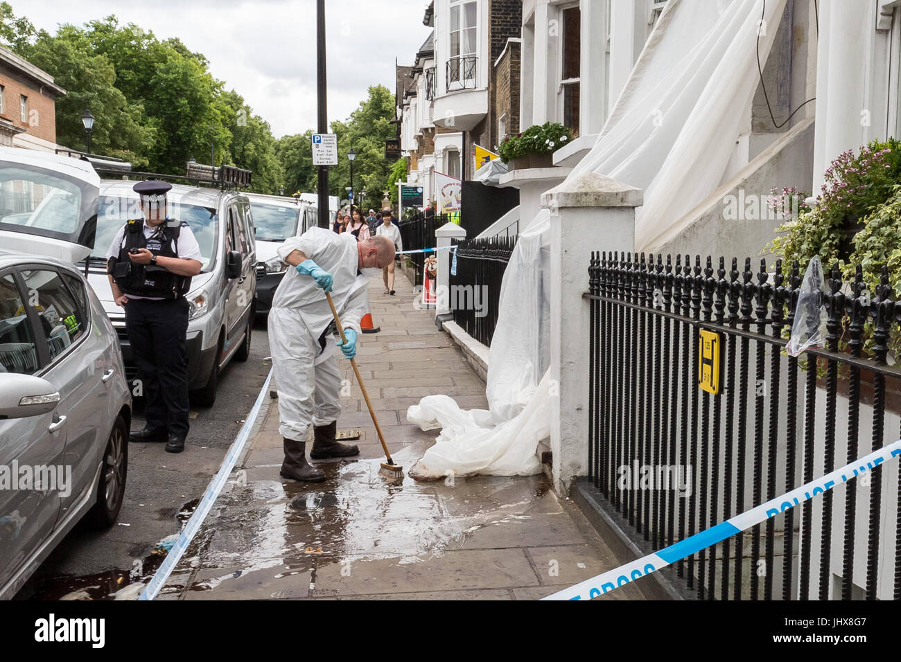London, UK. 16th July, 2017. Greenwich murder investigation. Police forensic teams clean up after investigations at the scene of the crime. Danny Pearce, 31, was stabbed to death by two men on a moped near Greenwich Park in the early hours of Saturday who ordered him to hand over his mobile phone. The victim was fatally wounded during a clash in which shots were also fired the Metropolitan Police have said.© Guy Corbishley/Alamy Live News Stock Photo