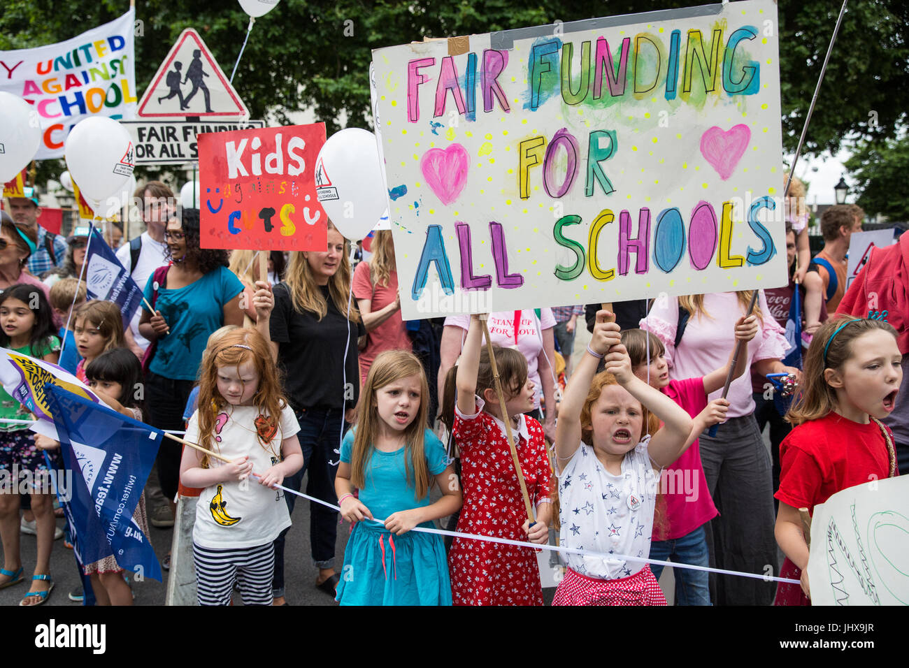 London, UK. 16th July, 2017. Children among campaigners against cuts to education funding and their families marching to Parliament Square as part of a Carnival Against The Cuts protest organised by Fair Funding For All Schools. Credit: Mark Kerrison/Alamy Live News Stock Photo