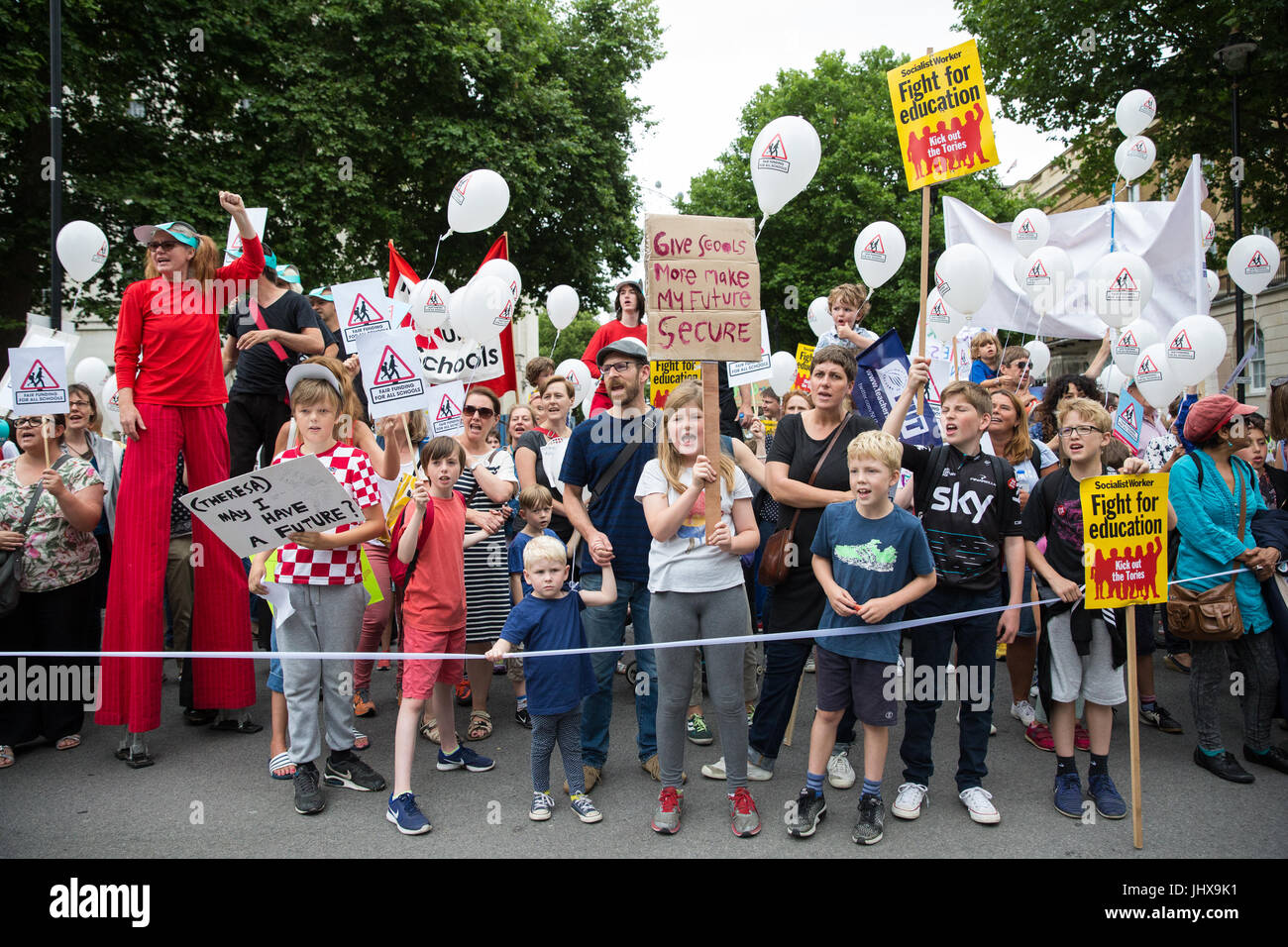 London, UK. 16th July, 2017. Children among campaigners against cuts to education funding and their families marching to Parliament Square as part of a Carnival Against The Cuts protest organised by Fair Funding For All Schools. Credit: Mark Kerrison/Alamy Live News Stock Photo