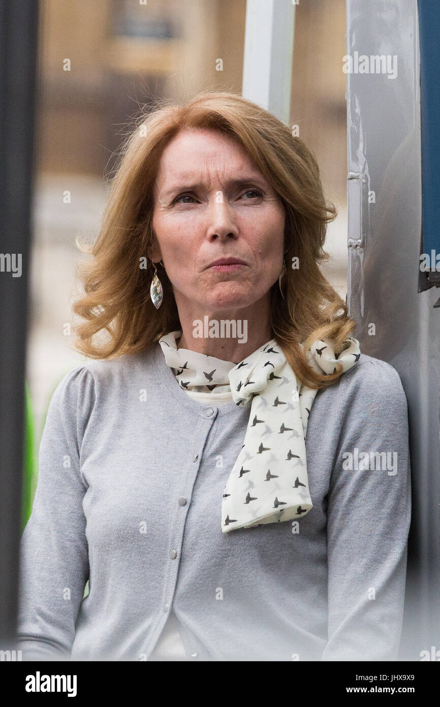 London, UK. 16th July, 2017. Mary Sandell, a headteacher who has just resigned after 29 years in protest against funding cuts, listens to speakers addressing campaigners against cuts to education funding and their families in Parliament Square as part of a Carnival Against The Cuts protest organised by Fair Funding For All Schools. Credit: Mark Kerrison/Alamy Live News Stock Photo