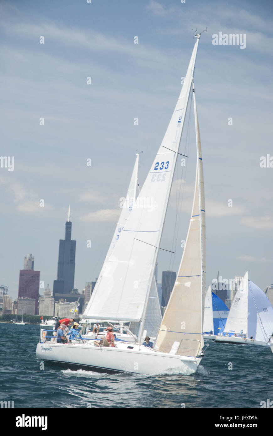 Chicago, IL, USA. 15th July, 2017. The boats are off in the Chicago Race to Mackinac. The ''cruising'' fleet of slower boats started their across-the-lake journey on Friday afternoon, July 14th. On Saturday, 19 fleets of boats began in waves every ten minutes. The largest and fastest boat were in the last two sections - turbo and multihull. The record-holder for time for a monohull occured in 2002 by Roy Disney's Pyewacket at 23 hours 30 minutes. High winds and waves have caused 70 boats to drop out of the race by Sunday afternoon. Two boats capsized. 5 crew members were rescued by another Stock Photo