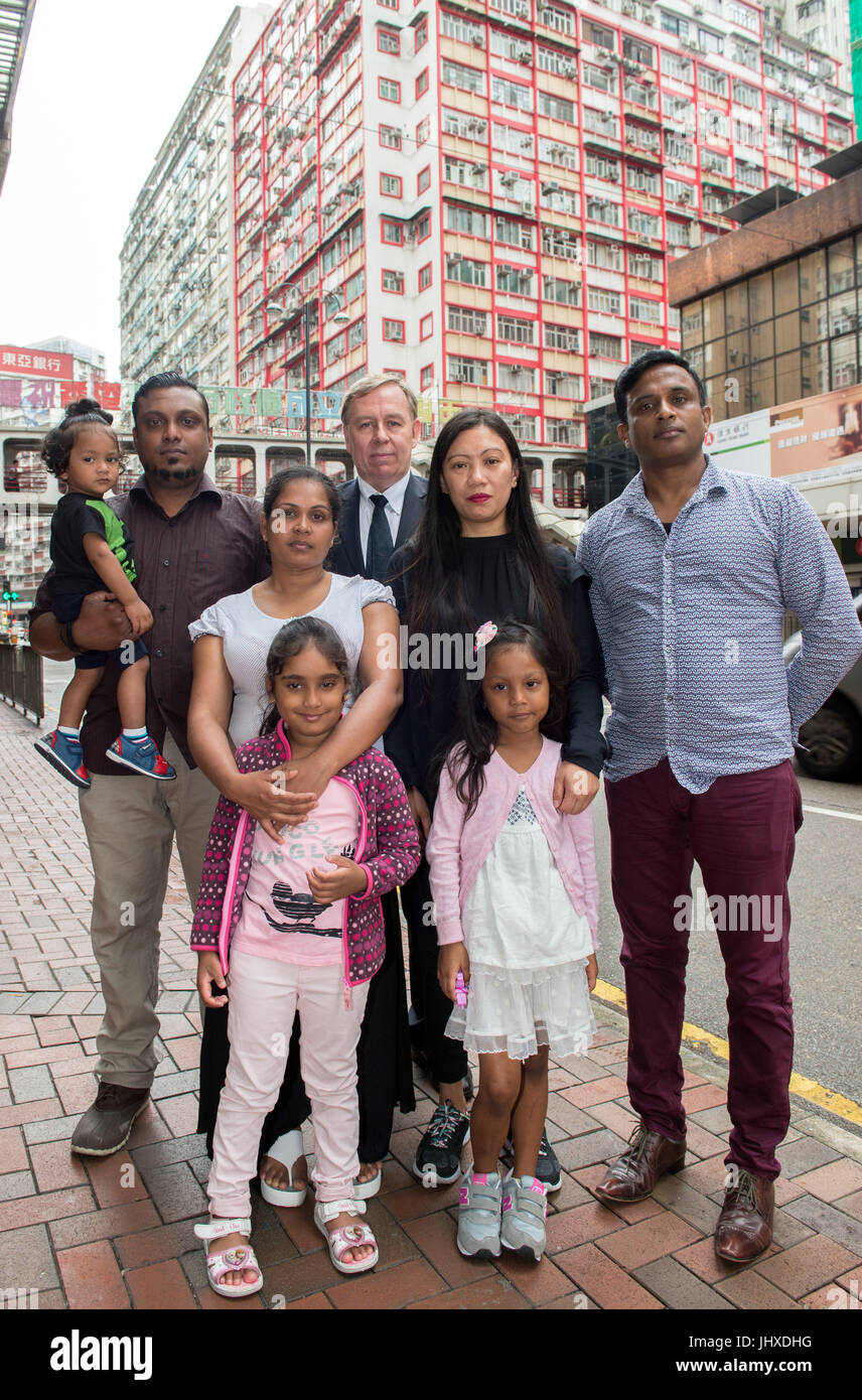 Hong Kong, Hong Kong SAR, China. 17th July, 2017. The Snowden Guardian angels appear at the Torture claims appeal Board to challenge rejection of their refugee claims.Despite arriving in Hong Kong in different years the families claims have been link due to their harbouring of whistleblower Edward Snowden. L. Supun Thilina Kellapatha with his son Dinath, Nadeeka Nonis, Barrister Robert Tibbo, Vanessa Mae Rodel and Ajith Puspa.Front L Nadeeka's daughter Sethumdi and Vanessa's daughter Keana.Hong Kong, Hong Kong SAR, China on July 17, 2017. (Credit Image: © Jayne Rus Stock Photo