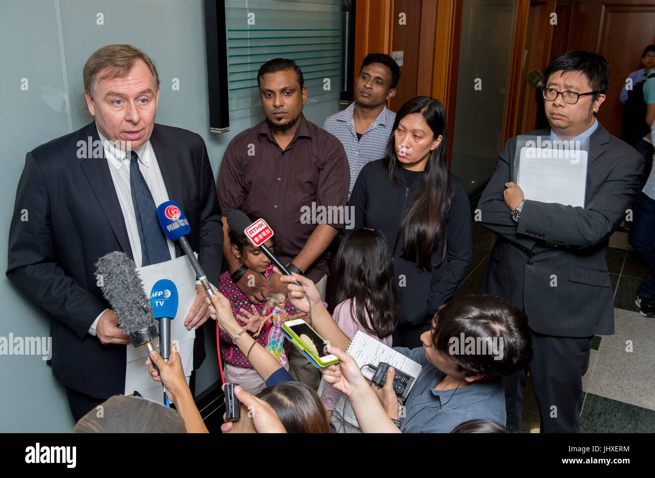 Hong Kong, Hong Kong SAR, China. 17th July, 2017. The Snowden Guardian angels appear at the Torture claims appeal Board.Despite arriving in Hong Kong in different years the families claims have been link due to their harbouring of whistleblower Edward Snowden. Barrister Robert Tibbo speaks to the press (L), Supun Thilina Kellapatha (2nd L with his daughter Sethumdi), Ajith Puspa(3rd R), Vanessa Mae Rodel (2nd R with her daughter Keana) and lawyer Jonathan Man Credit: Jayne Russell/ZUMA Wire/Alamy Live News Stock Photo