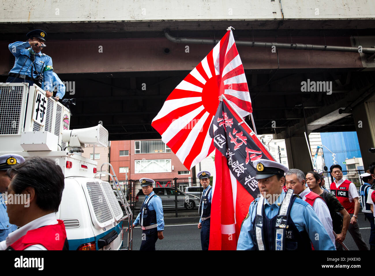 TOKYO, JAPAN - JULY 16: Japanese nationalists holding Japanese flags took to the streets in a 'hate demonstration' in Akihabara, Tokyo, Japan on July 16, 2017. The nationalists faced off with anti-racist groups who mounted counter protests demanding an end to hate speech and racism in Japan. Credit: Richard Atrero de Guzman/AFLO/Alamy Live News Stock Photo