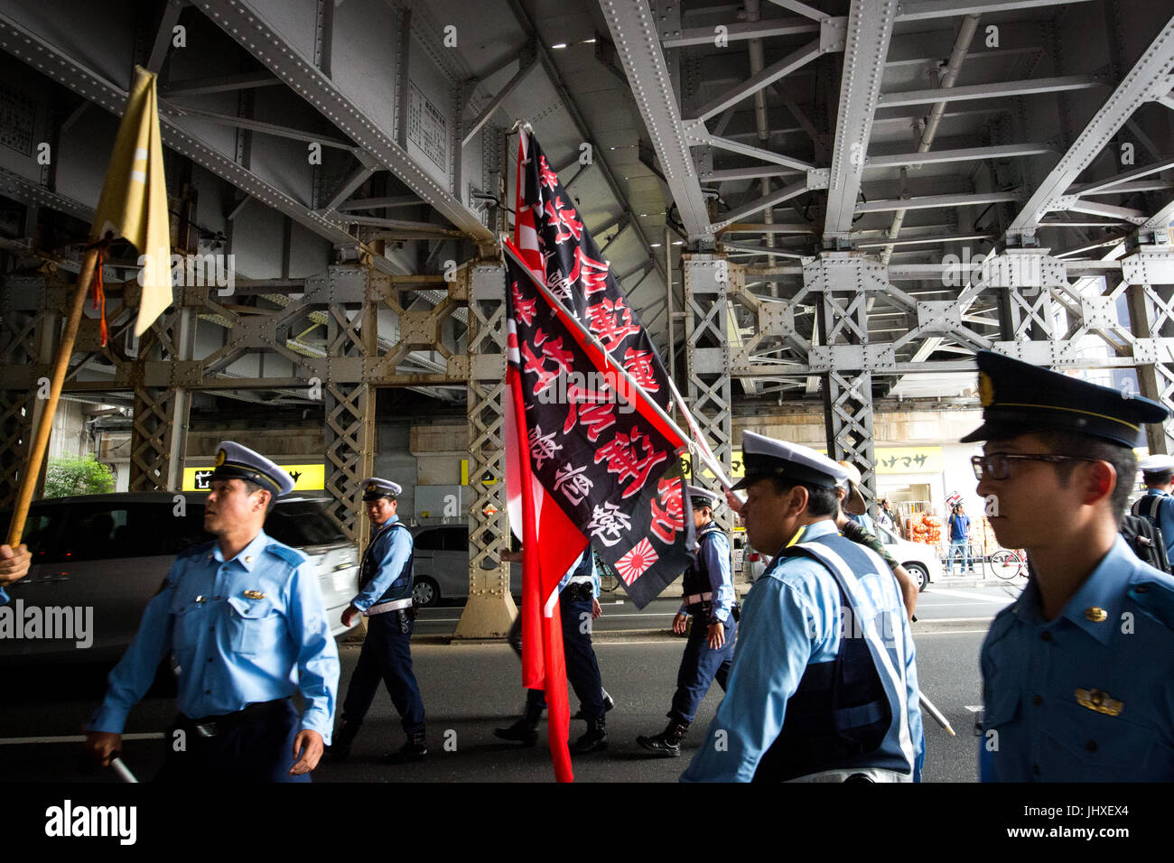 TOKYO, JAPAN - JULY 16: Japanese nationalists holding flags took to the streets in a 'hate demonstration' in Akihabara, Tokyo, Japan on July 16, 2017. The nationalists faced off with anti-racist groups who mounted counter protests demanding an end to hate speech and racism in Japan. Credit: Richard Atrero de Guzman/AFLO/Alamy Live News Stock Photo