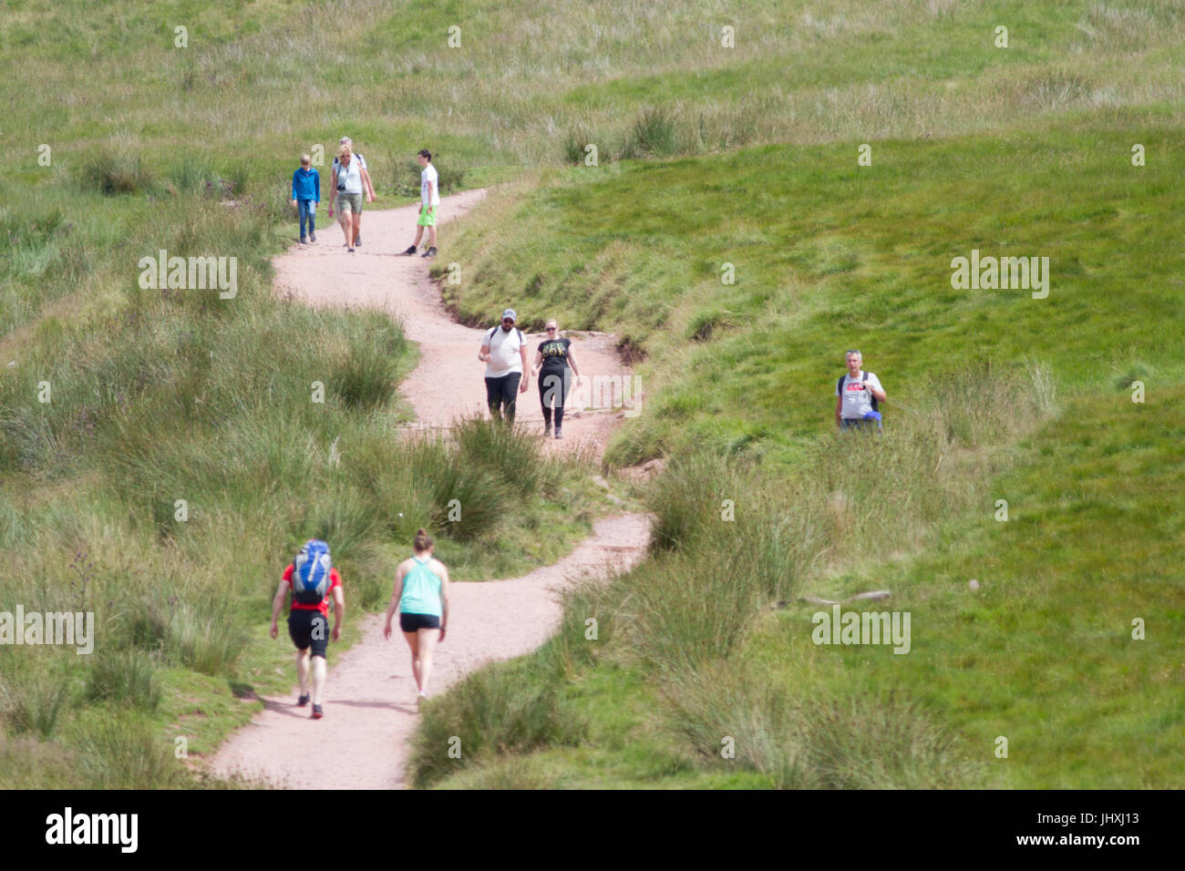 Pont Yr Daf., Brecon Beacons, South Wales, UK. 17th July, 2017. UK weather: People climb the walk to the top of Pen-Y-Fan today in sunny weather, as parts of the UK reach 26 degrees. Credit: Andrew Bartlett/Alamy Live News Stock Photo