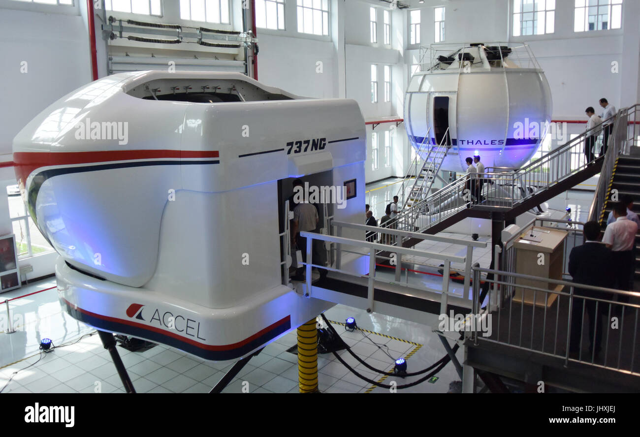 (170717) -- TIANJIN, July 17, 2017 (Xinhua) -- Photo taken on July 17, 2017 shows flight simulators in Tianjin, north China. An aviation company in Tianjin Monday received China's first top-level full flight simulator. The simulator was delivered by ACCEL (Tianjin) Flight Simulation, a joint Sino-U.S. venture between Haite High-Tech and Rockwell Collins, established last year. (Xinhua/Mao Zhenhua) (mcg) Stock Photo