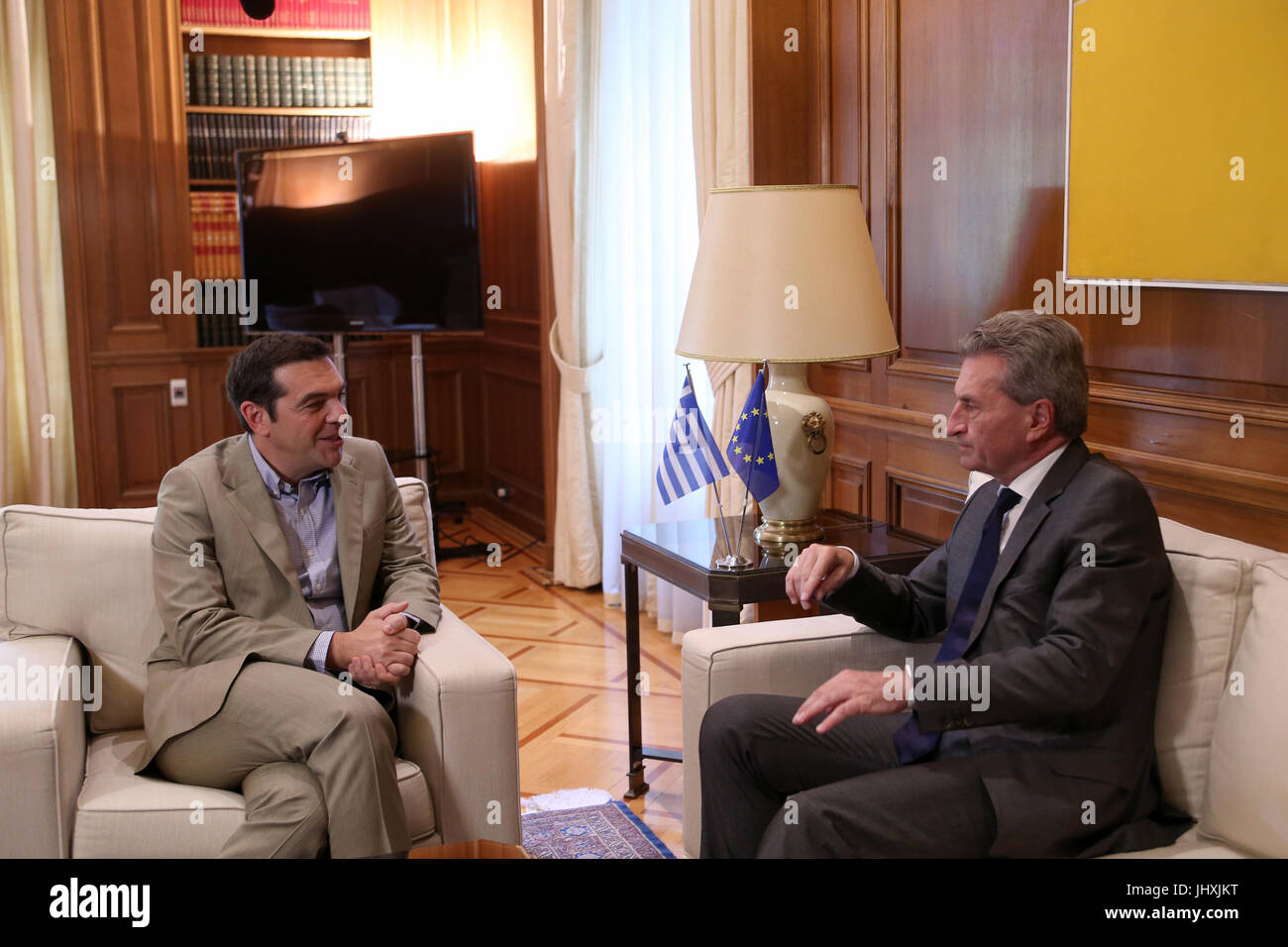 Athens, Greece. 17th July, 2017. Greek Prime Minister Alexis Tsipras (L) meets with European Commissioner for budget and human resources Gunther Oettinger in Athens, Greece, July 17, 2017. Credit: Marios Lolos/Xinhua/Alamy Live News Stock Photo