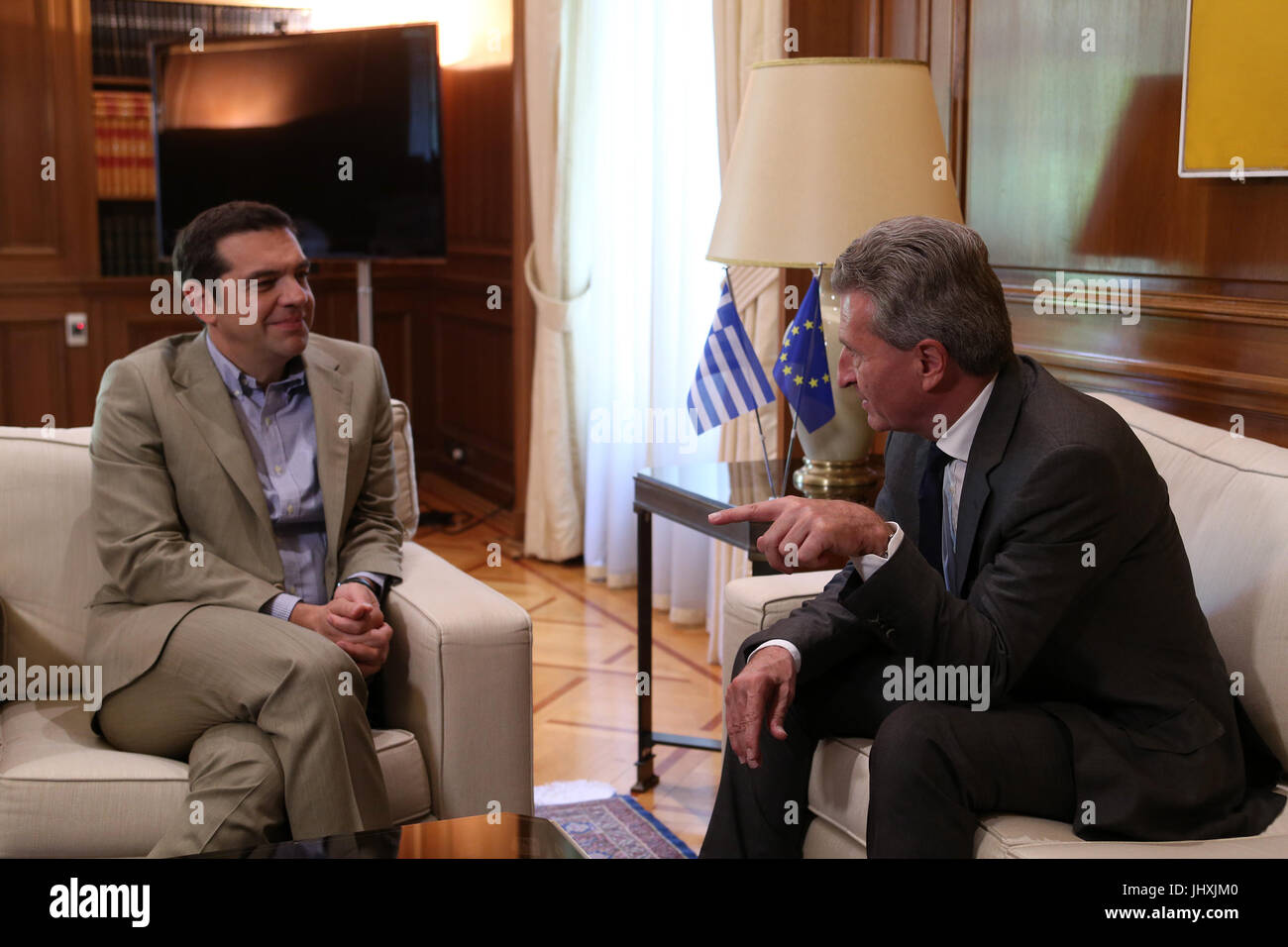 Athens, Greece. 17th July, 2017. Greek Prime Minister Alexis Tsipras (L) meets with European Commissioner for budget and human resources Gunther Oettinger in Athens, Greece, July 17, 2017. Credit: Marios Lolos/Xinhua/Alamy Live News Stock Photo