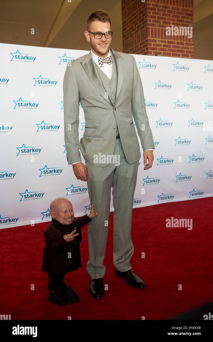 ST. PAUL, MN JULY 16: Verne Troyer and NBA player Cole Aldrich pose on the red carpet at the Starkey Hearing Foundation 'So The World May Hear Awards Gala' on July 16, 2017 in St. Paul, Minnesota. Credit: Tony Nelson/Mediapunch Stock Photo