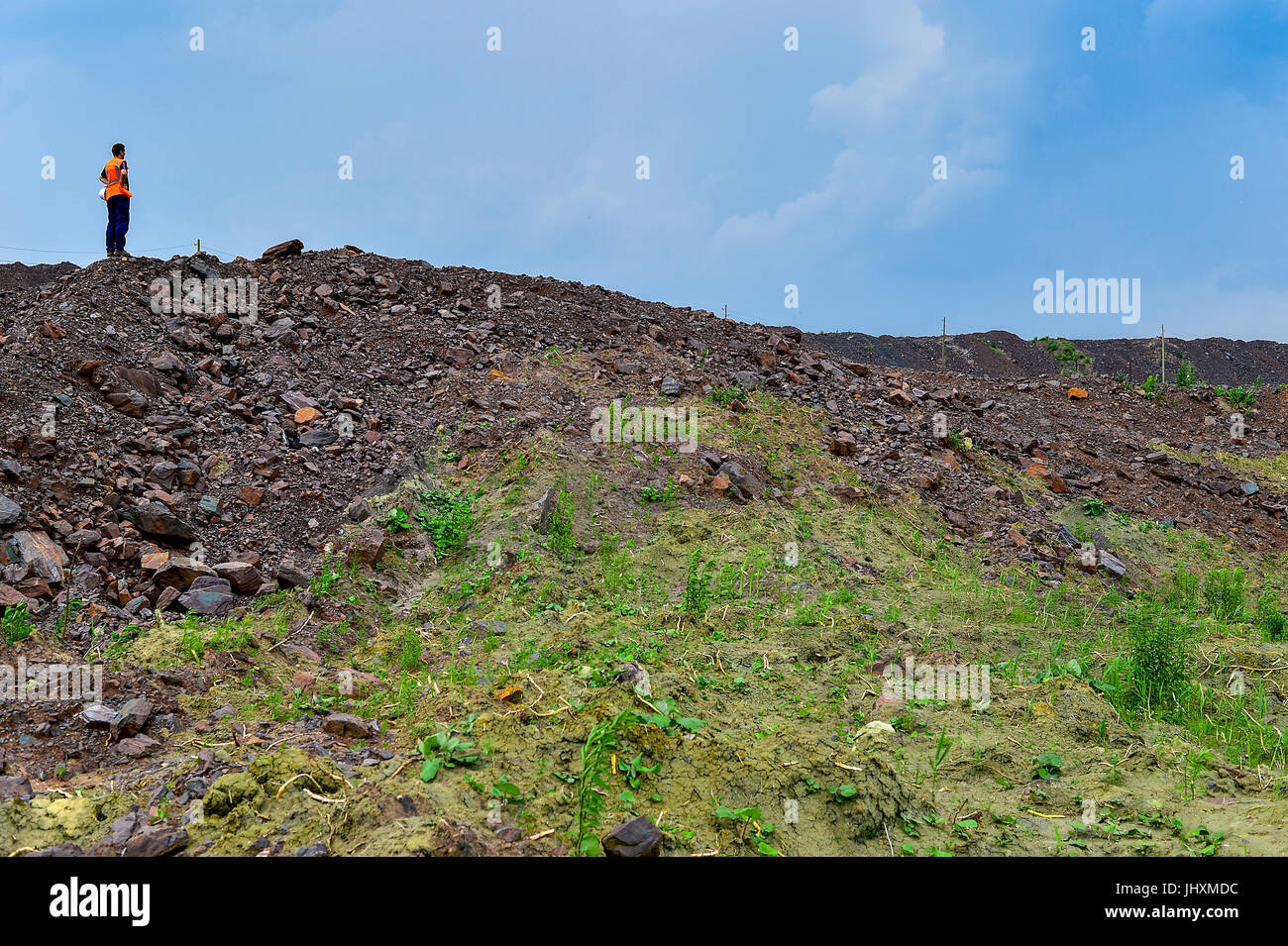 Dumps rock mountains from industrial quarries. Stock Photo