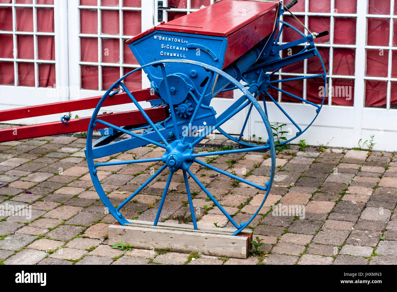 Old fashioned / antique farm machinery, seed spreader, cast iron, used for drilling wheat barley oats Stock Photo