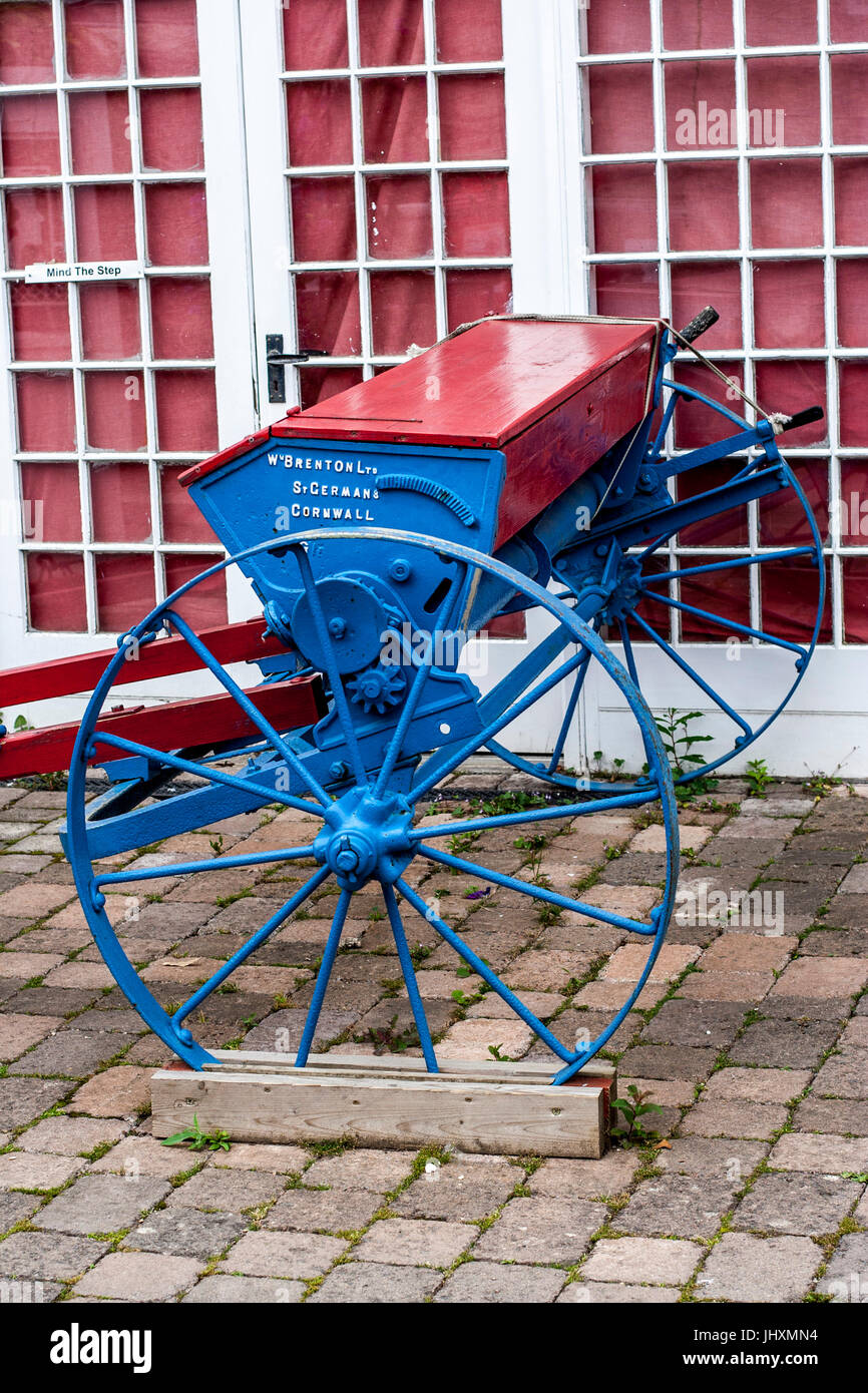 Old fashioned / antique farm machinery, seed spreader, cast iron, used for drilling wheat barley oats Stock Photo