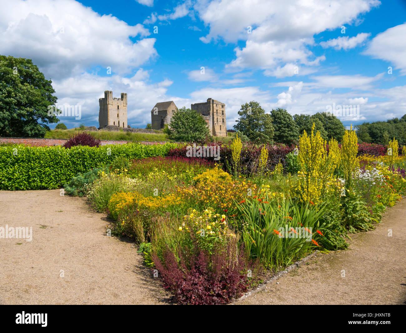 Helmsley Castle overlooking the Helmsley Walled Garden with a show of