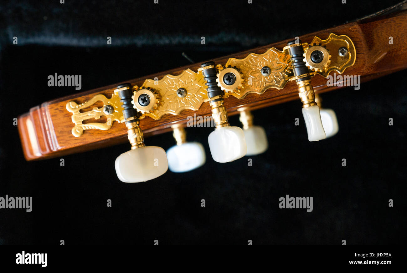 Close up of Antonio Sanchez classical guitar head and tuning pegs against black background Stock Photo