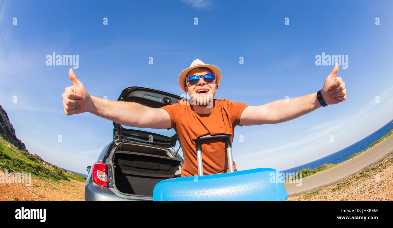 Summer, holiday, trip and vacation concept - Happy funny man near the car showing thumbs up and ready to travel Stock Photo - Alamy Summer, holiday, trip and vacation concept - Happy funny man near the car showing thumbs up and ready to travel Stock Photo - Alamy