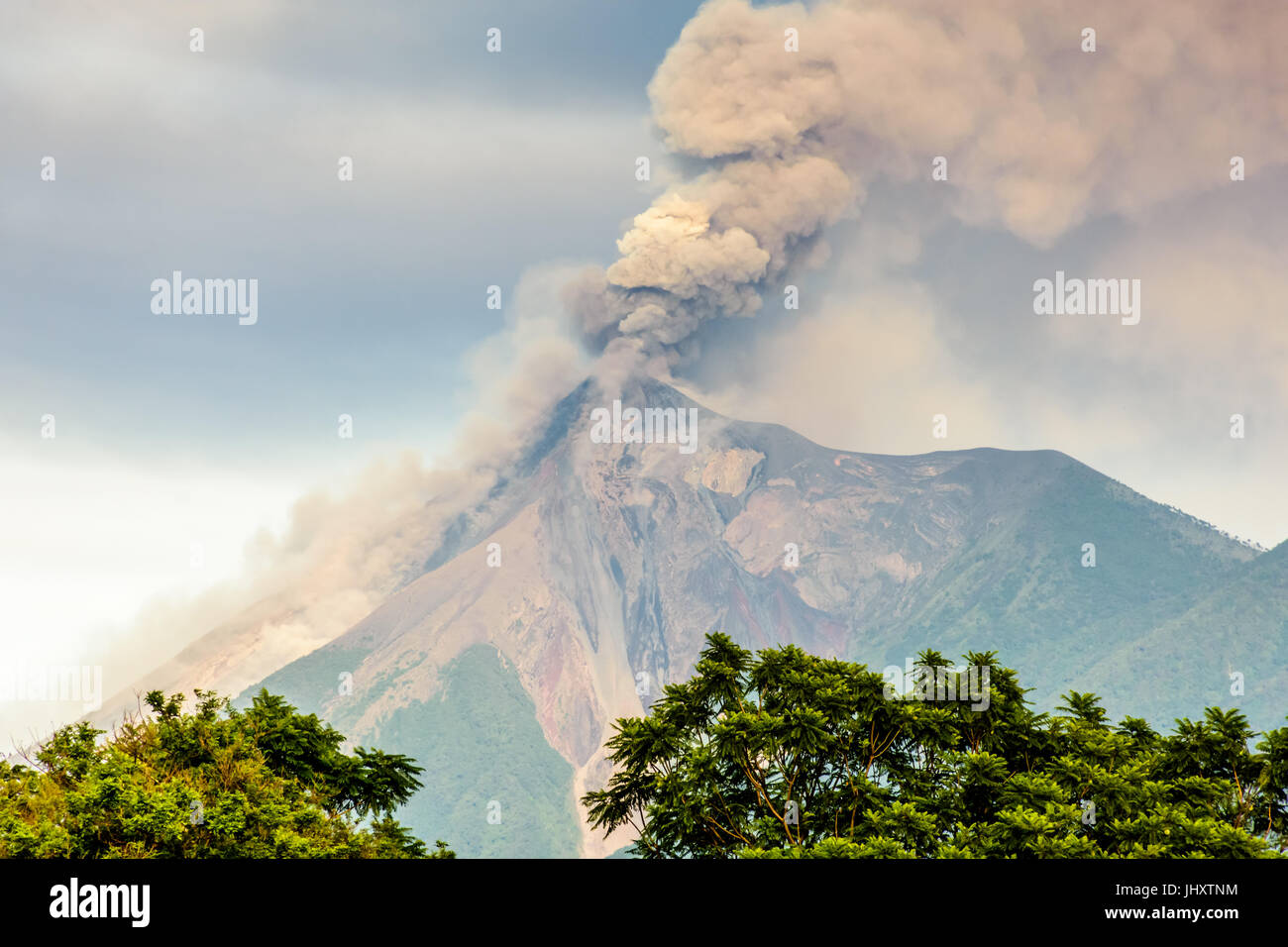 Smoke billows from erupting Fuego volcano just after dawn near Antigua, Guatemala, Central