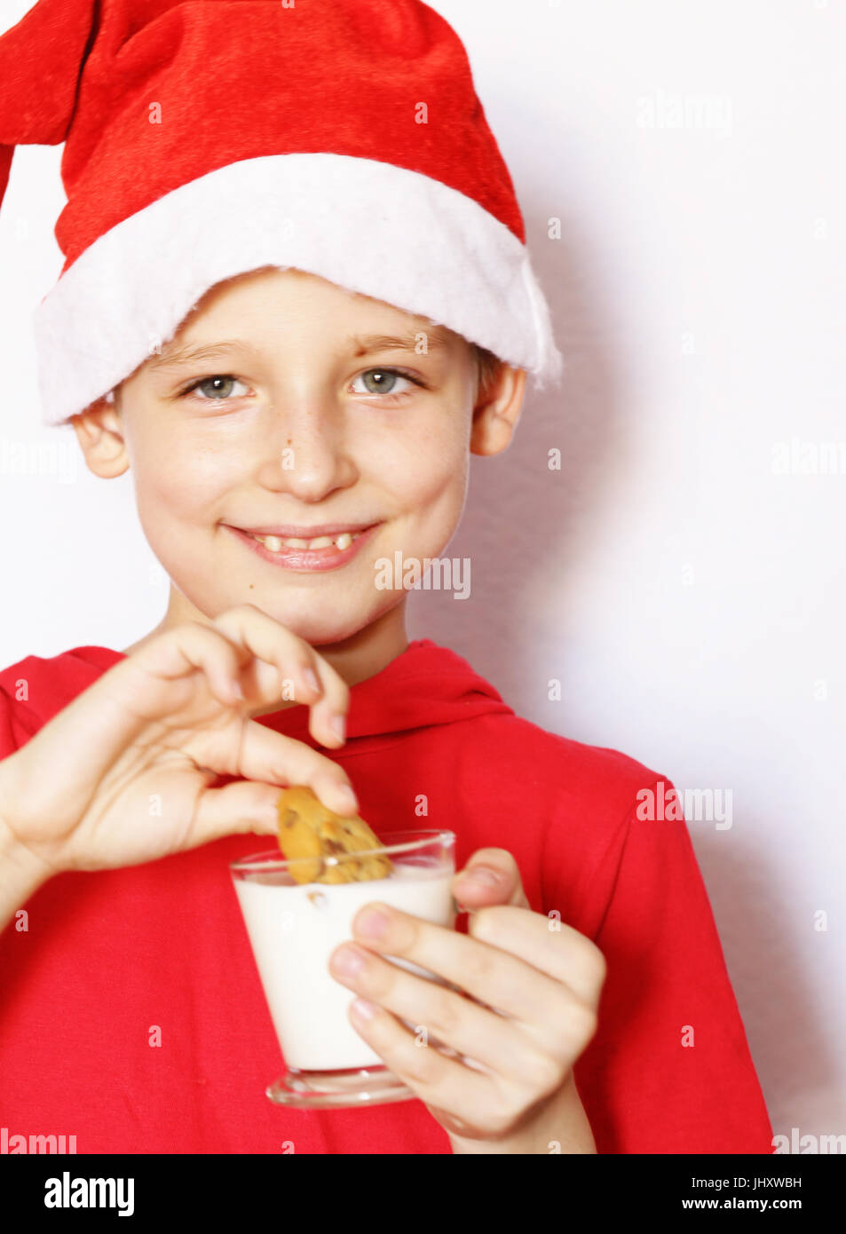 Portrait of a cute boy dressed as Santa Stock Photo Alamy